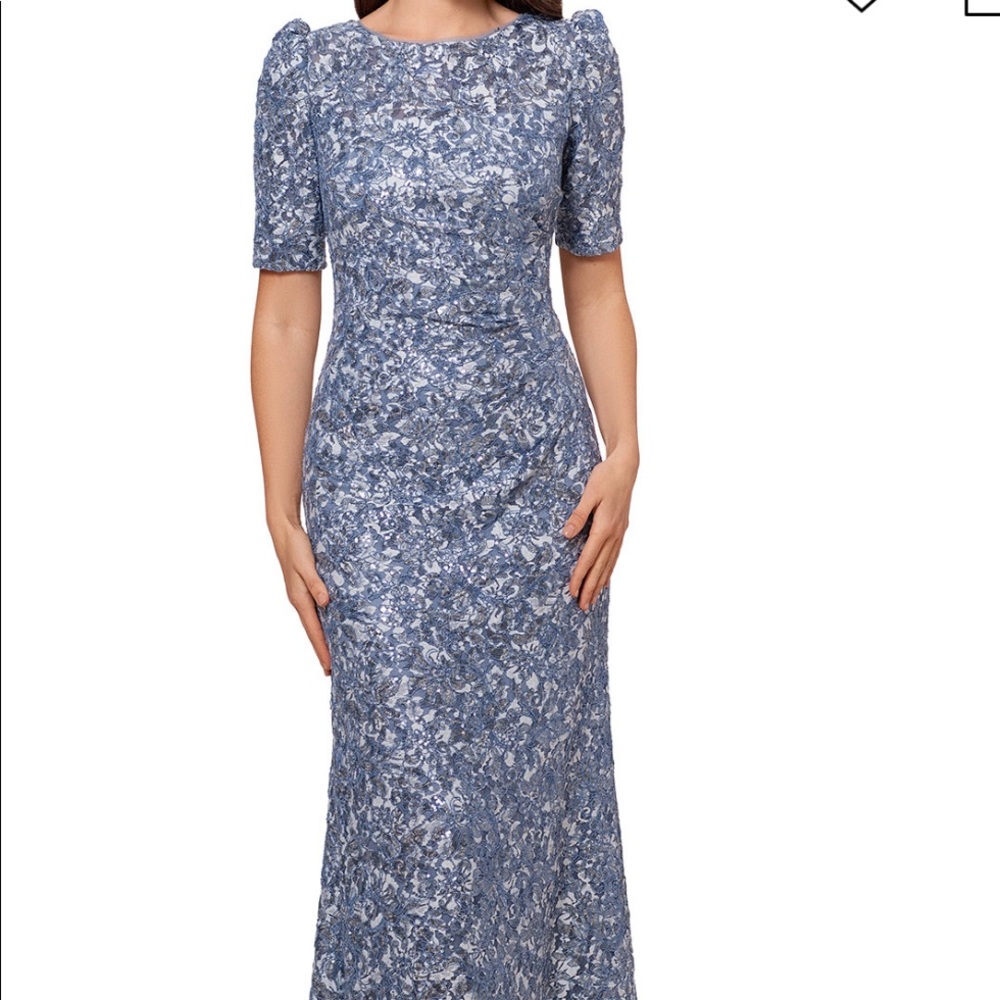 Xscape full length formal gown. Size 14p. NWT. Light blue with sequins.